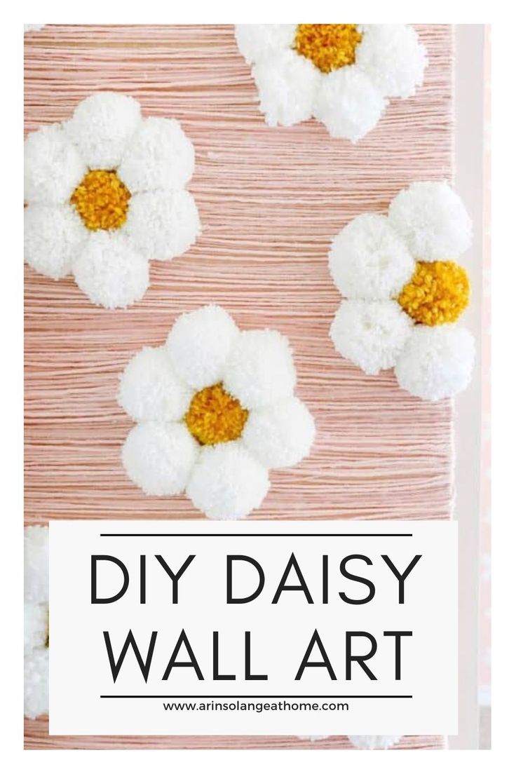 three white and yellow flowers with the words diy daisy wall art on it's side