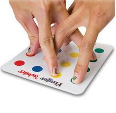 two hands on top of a polka dot board