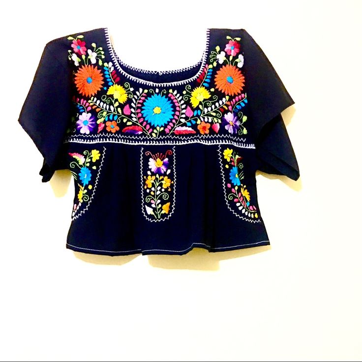 Mexican Blouse Note: Black Crop Top Embroidered Slouchy Boxy Bohemian Mexico Traditional Blue Embroidery Rare Ooak Piece Size: S/ M M/L Xl Black Summer Blouse With Geometric Embroidery, Black Floral Embroidery Festival Top, Black Cotton Tops With Intricate Embroidery, Black Floral Print Festival Blouse, Black Blouse With Geometric Embroidery For Summer, Black Floral Print Blouse For Festival, Black Summer Tops With Intricate Embroidery, Black Embroidered Festival Tops, Black Tops With Intricate Embroidery For Summer