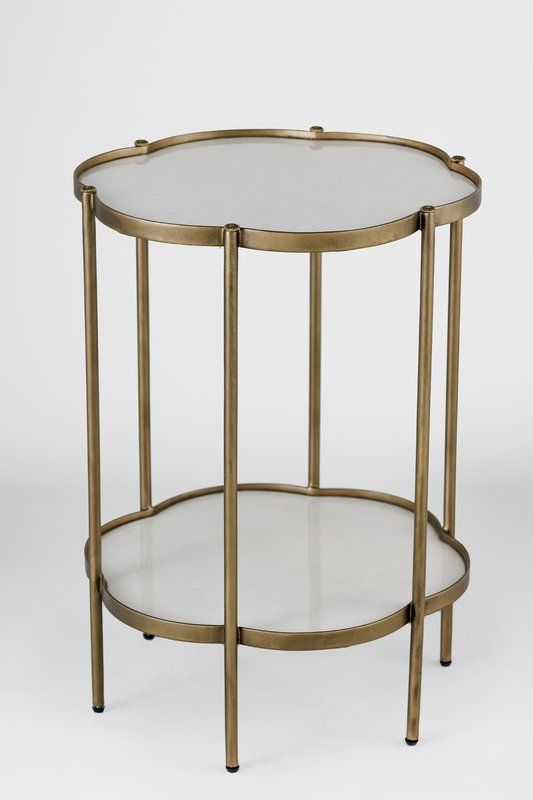 a round glass and metal table with two shelves on one side, the top half is gold