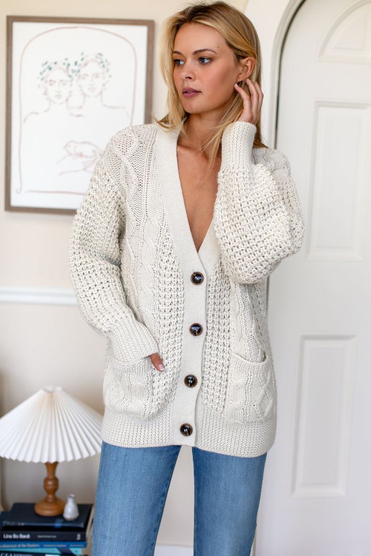 A luxe heirloom quality cardigan in the perfect, wear forever silhouette. Incredibly soft medium weight knit, jacket alternative, cozy layering. 100% super soft, extra fine alpaca Drop shoulder Patch pockets Model is wearing a size Small Dry clean Made in Peru XS: Bust 41”, Center back length 24 1/2"S: Bust 43”, Center back length 25"M: Bust 45”, Center back length 25 1/2"L: Bust 47”, Center back length 26" Cozy V-neck Cardigan With Soft Texture, Elegant Fall Sweater With Soft Texture, V-neck Cable Knit Outerwear For Layering, Cream Knit V-neck Outerwear, Cozy V-neck Outerwear For Everyday, Soft Knit V-neck Outerwear, Winter White Long Sleeve Cashmere Sweater, Fall Cream Cashmere Sweater, Winter White V-neck Sweater For Fall