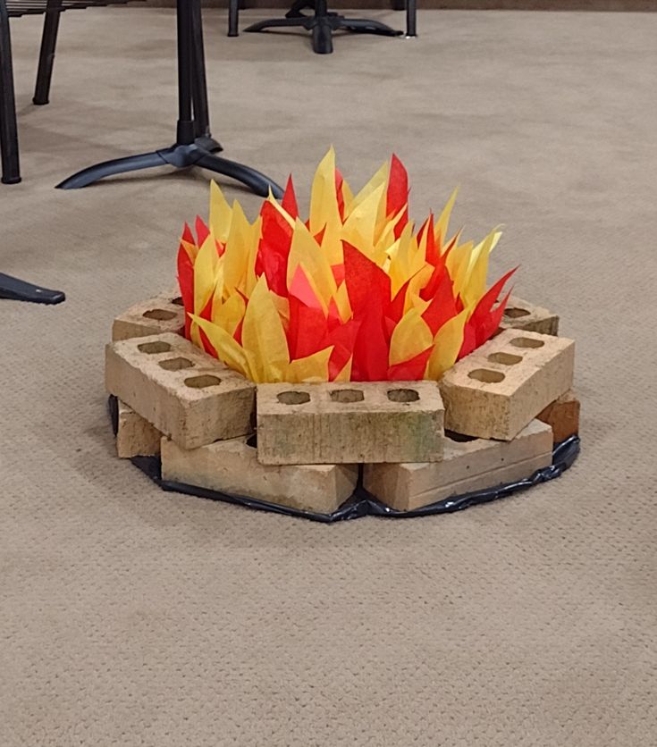 a fire pit made out of bricks on the floor