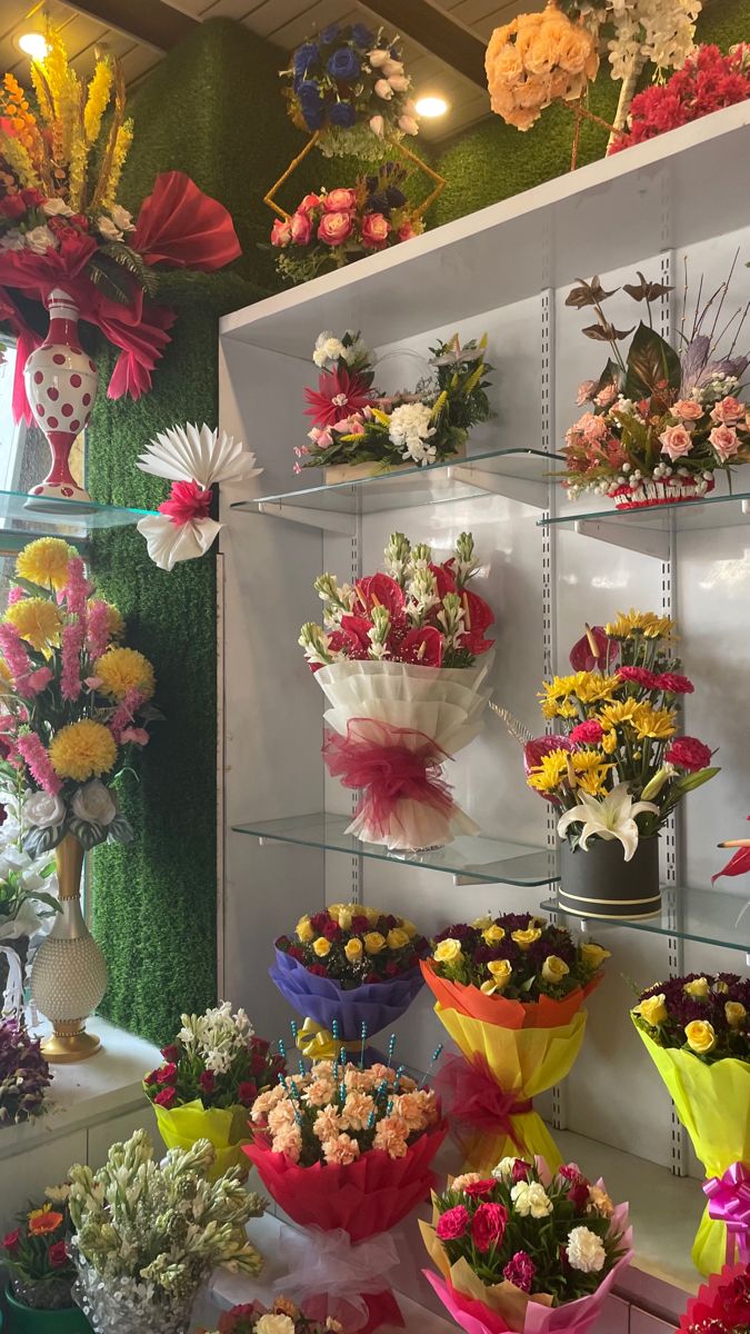 a display case filled with lots of different types of flowers