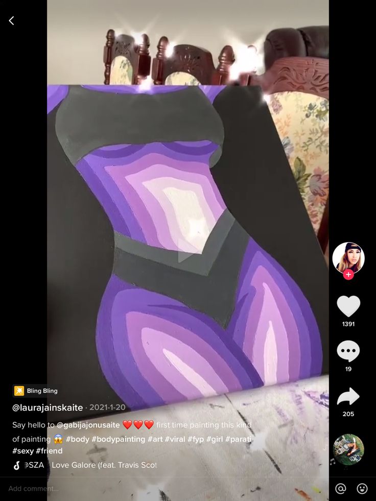 an image of a woman's torso in purple and black on the instagram page