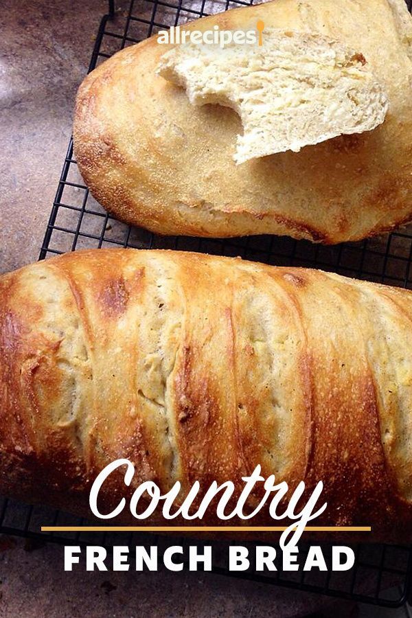 two loaves of bread sitting on top of a cooling rack next to each other