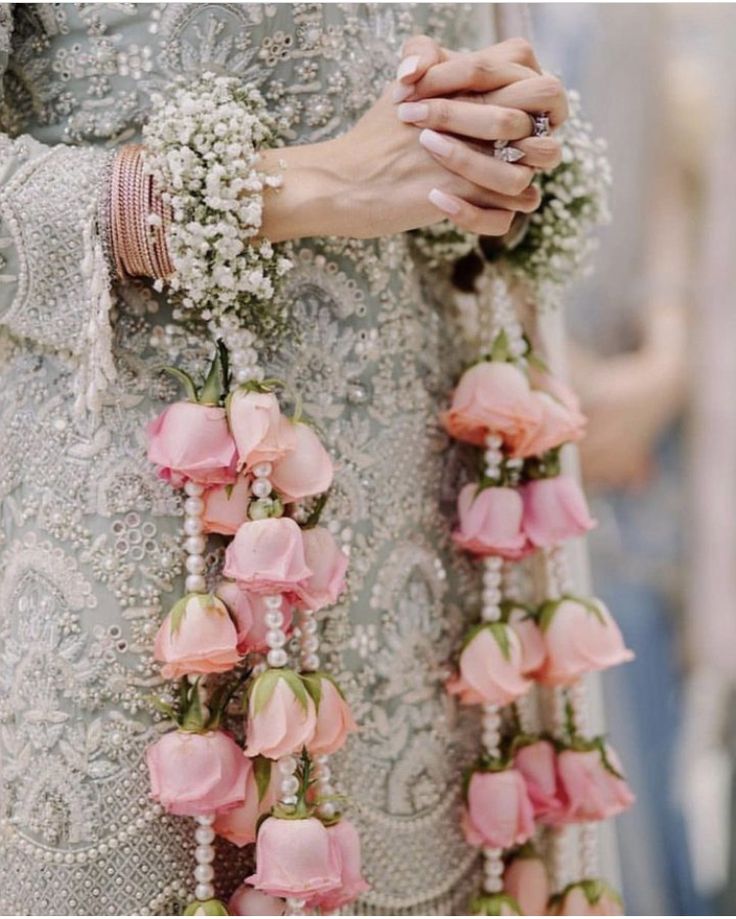 a close up of a person holding flowers