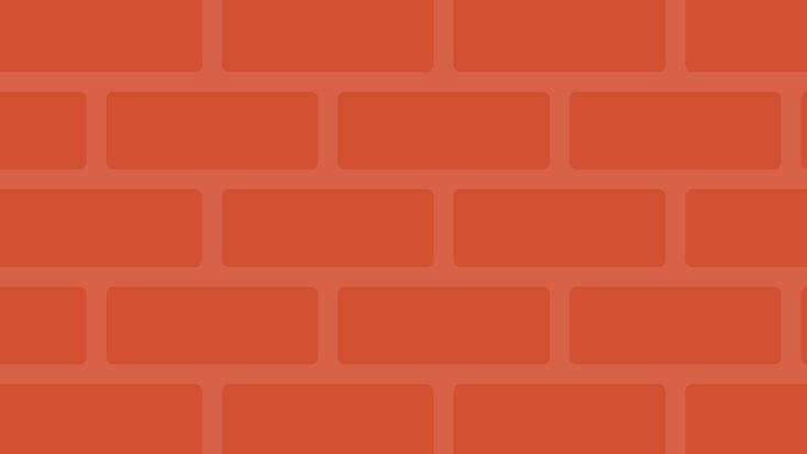 an orange brick wall that is very large and has small squares on the top half