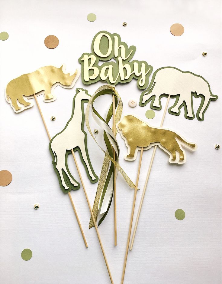 there are some cake toppers that have animals on them and the words oh baby