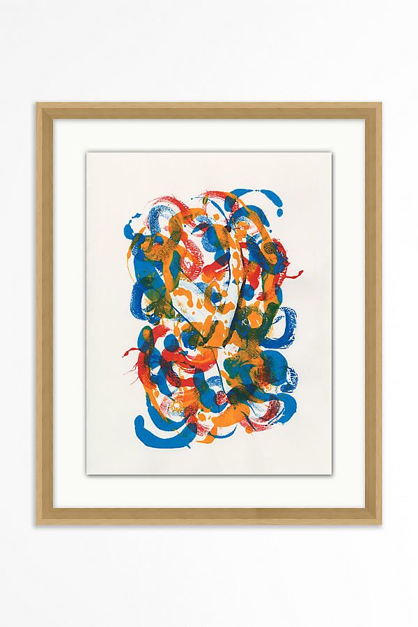 an abstract painting with blue, orange and red colors on white paper in a wooden frame