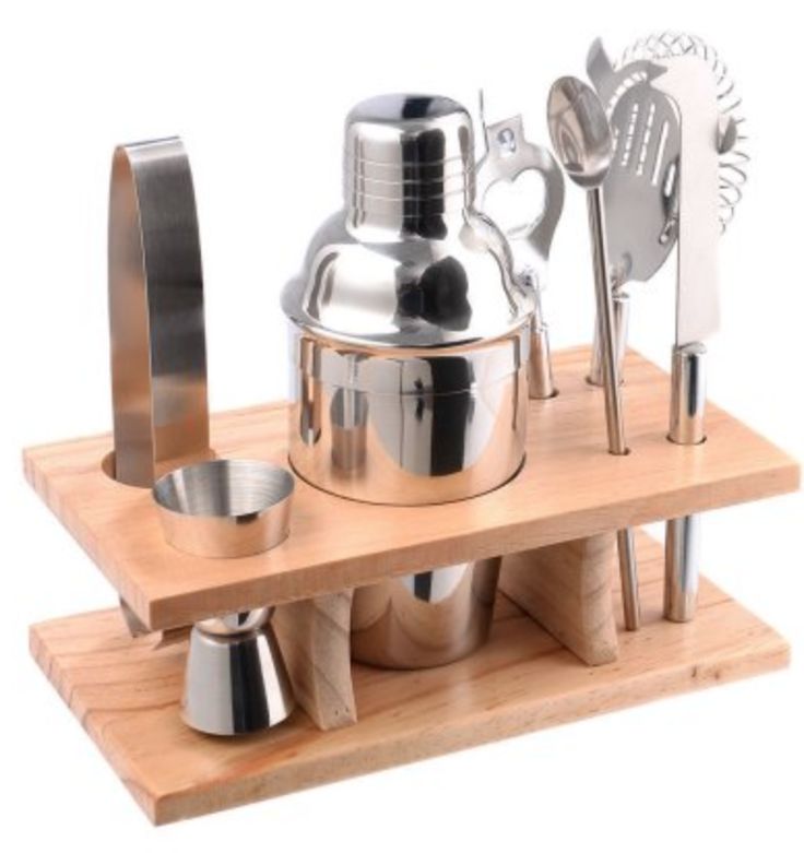 an assortment of kitchen utensils on a wooden tray