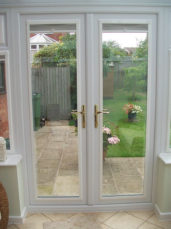 an open patio door leading to a back yard