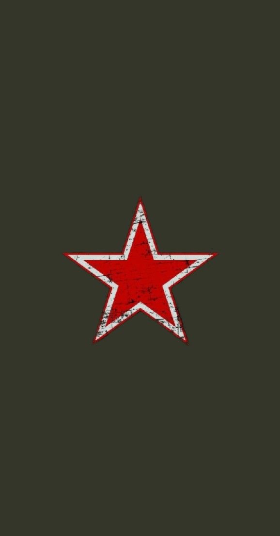 a red star on a black background with grungy edges and an old - fashioned effect