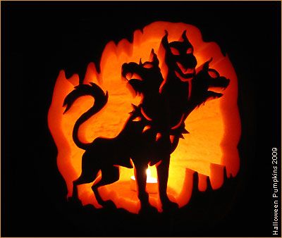 a carved pumpkin with a cat and dog on it