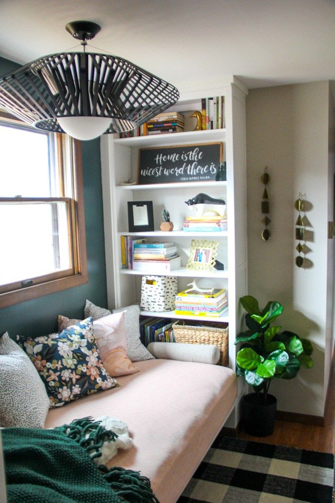 a living room with bookshelves and a couch