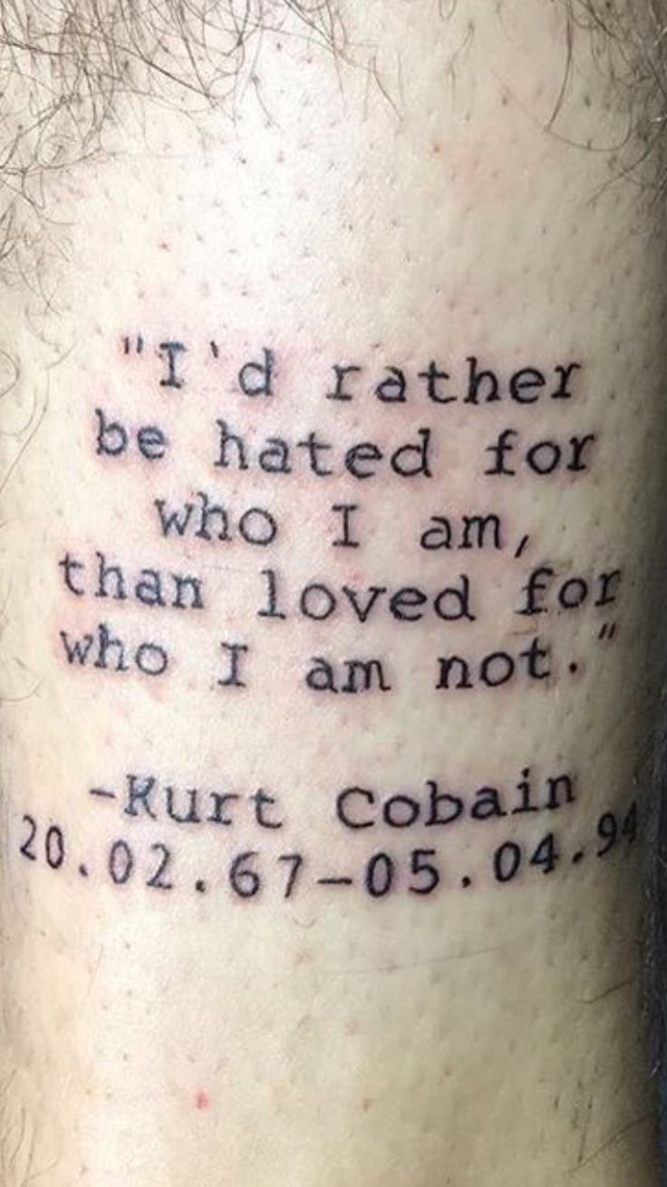 a man with a tattoo on his leg that says i'd rather be hated for