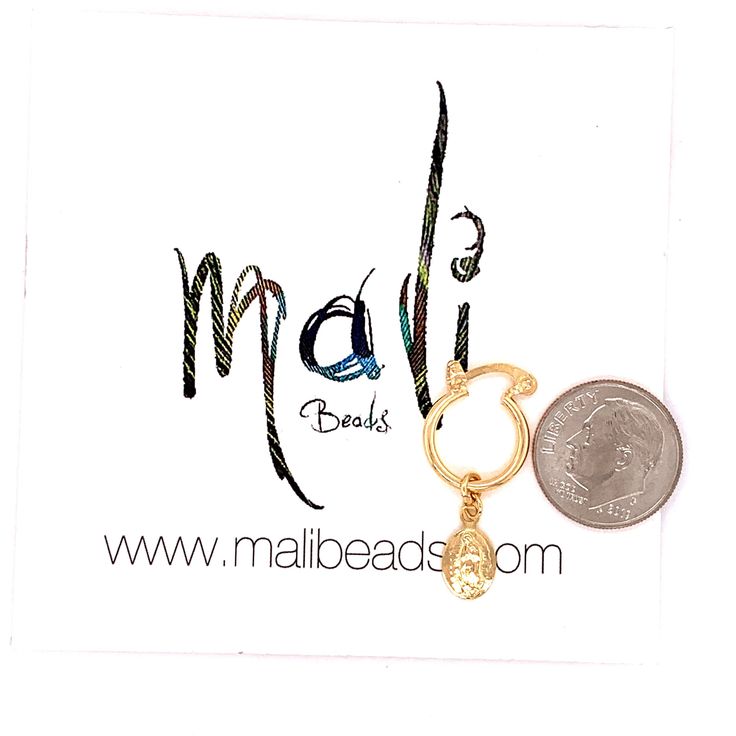 18kt Gold Filled Our Lady of Guadalupe Coin Hoop Earrings Hoop Size: 12mm Width: 2mm Coin Size: 6mmx11mm Clasp: Hinged Product Care: To properly care for your new MaLi Beads please remember to: Apply beauty products such as perfume, hairspray or deodorant before wearing your jewelry as certain chemicals in these products may damage the finish. Always remove your jewelry before swimming, doing household chores or using abrasive cleaners. Gold Hypoallergenic Septum Ring For Anniversary, Gold Hoop Cartilage Earrings For Anniversary, Gold Hypoallergenic Nose Rings For Anniversary, Gold Small Hoop Nose Rings For Anniversary, Gold Huggie Nose Rings Nickel Free, Nickel Free Gold Huggie Nose Rings, Gold Hoop Earrings With Charms As Gift, 14k Gold Filled Hoop Earrings With Charms As Gift, Adjustable Gold Hoop Huggie Earrings