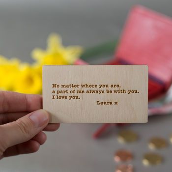 someone is holding up a wooden card that says he matters where you are, a part of me always be with you i love you