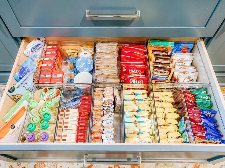 an open refrigerator filled with lots of food and condiments on top of it