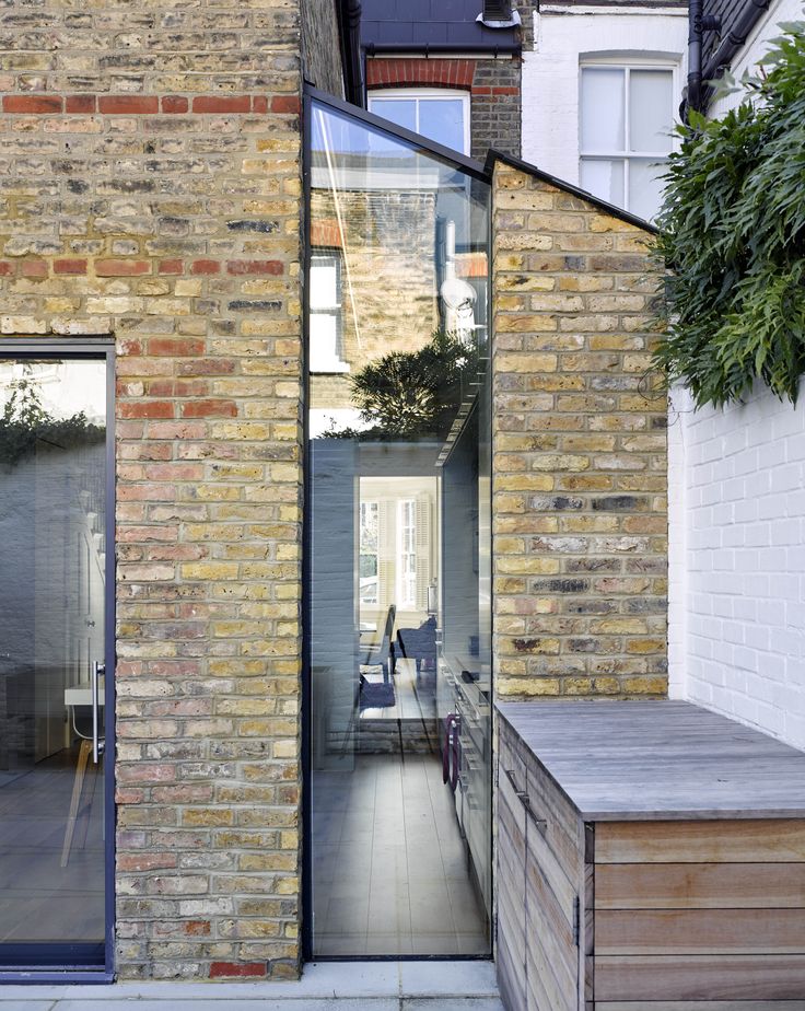 an outside view of a brick building with glass doors