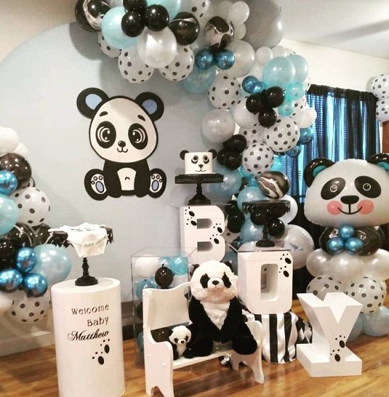 a room filled with balloons and panda bears