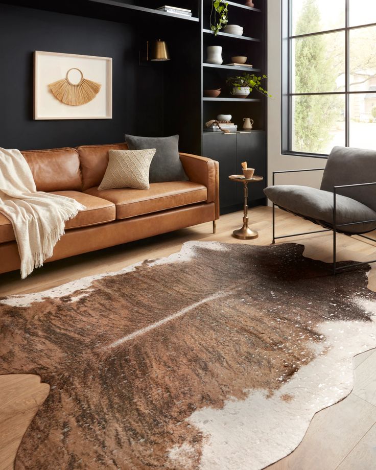 a living room filled with furniture and a brown rug