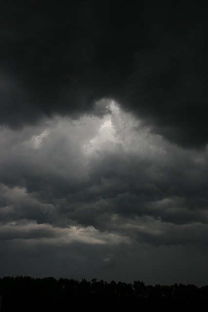 the sky is dark and cloudy as it appears to be overcast with storm clouds