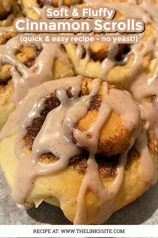 there are cinnamon rolls with icing on the top and one is drizzled