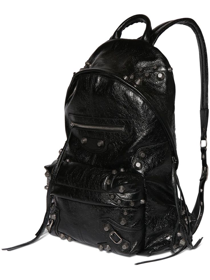 Height: 47cm Width: 34.8cm Depth: 19.8cm. Double adjustable straps. Single top handle. Zip closure. Silver-colored metal hardware. Two front zip pockets. One internal zip pocket Leather Backpack Black, Studded Backpack, Balenciaga Men, Balenciaga Logo, Latest Bags, Black Leather Backpack, Bags Logo, Balenciaga Bag, Crossbody Messenger Bag