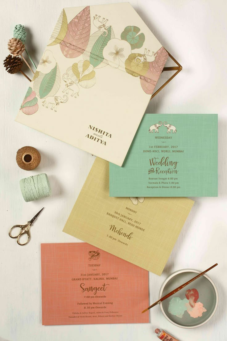 the wedding stationery is laid out and ready to be put into their guests'bags