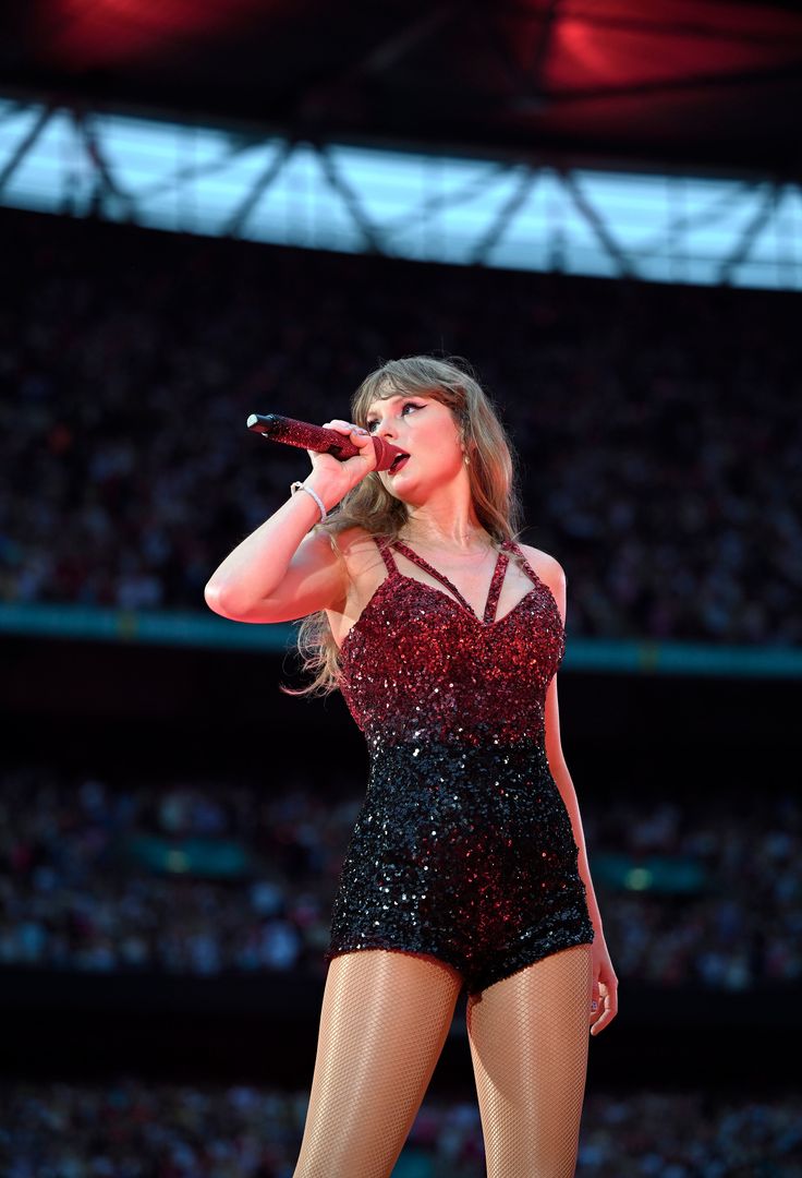 taylor swift performing on stage at the olympics