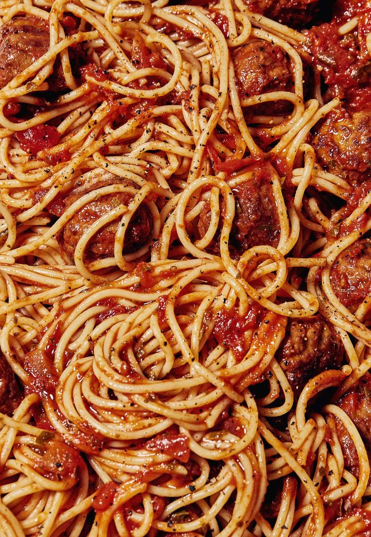 spaghetti with meatballs and sauce in a bowl