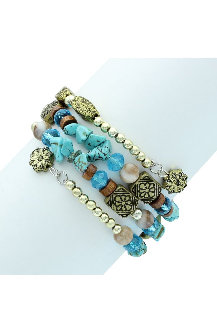 - Gold plated Tessa mixed stone wrap bracelet . No closure. Approx. 7" inner circumference. Imported Wipe with a damp cloth, do not submerge in water. Do not use jewelry cleaner. 14K gold plated base metal, resin Bohemian Metal Beaded Stackable Bracelets, Stackable Bohemian Metal Beaded Bracelets, Colorful Beaded Bangle, Trendy Gold Jewelry With Natural Stones, Trendy Gold Jewelry With Gemstone Beads, Trendy Gold Bracelets With Natural Stones, Trendy Hand Wrapped Gold Jewelry, Gold Bracelets With Gemstone Beads For Beach, Hand Wrapped Bracelet