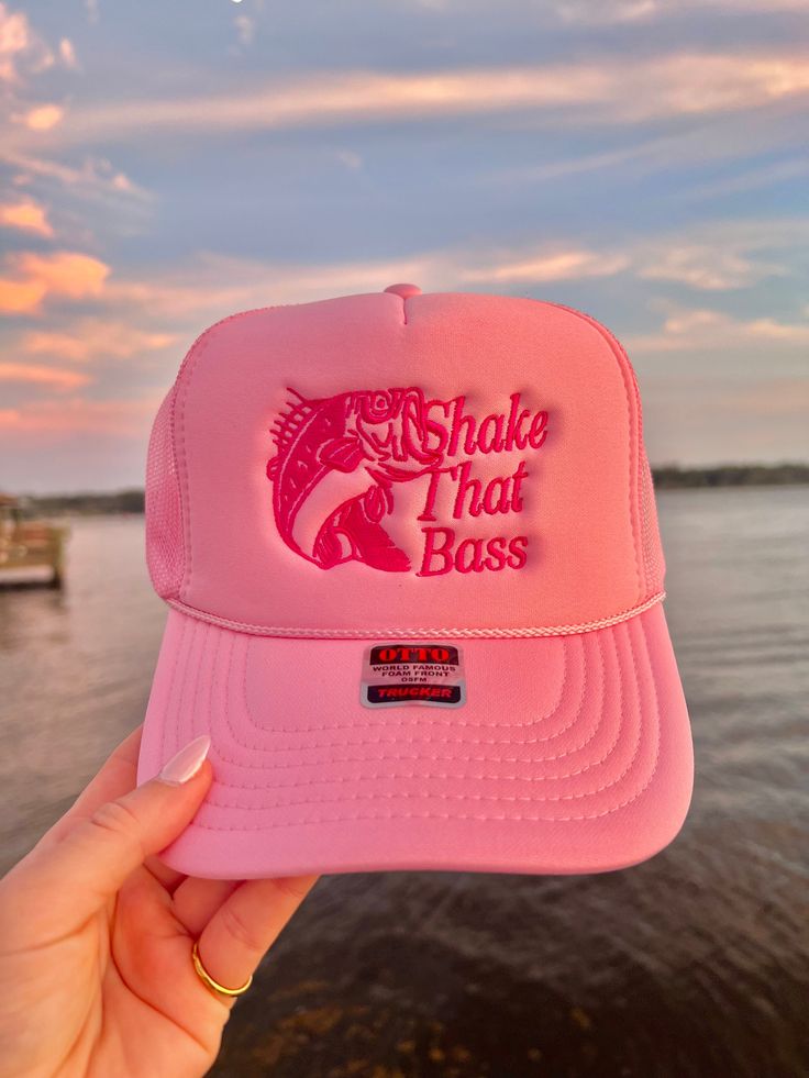 This adjustable OTTO trucker hat is so cute for summer time, it is adjustable and super comfy! It reads "Shake That Bass" and it has a bass detail on it all embroidered in hot pink! 🤍 Casual Pink Trucker Hat For Beach, Casual Pink Trucker Hat For The Beach, Pink Summer Trucker Hat For Outdoor, Pink Trucker Hat For Summer Outdoor, Pink Adjustable Trucker Hat For Outdoor, Adjustable Pink Trucker Hat For Outdoor, Summer Outdoor Pink Trucker Hat, Pink Snapback Hat For The Beach, Pink Adjustable Trucker Hat For Summer