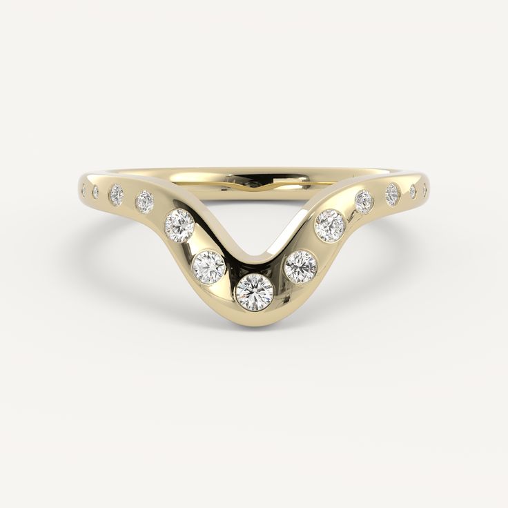 a yellow gold ring with diamonds on the sides and a curved band in the middle