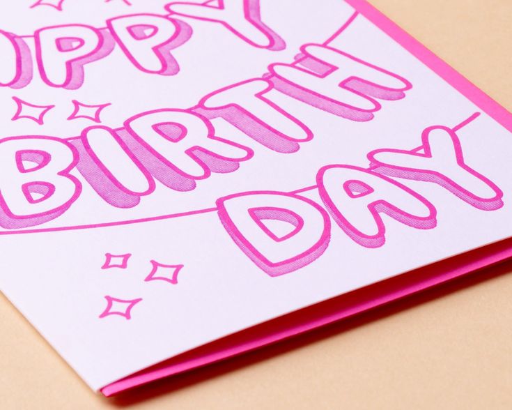 a birthday card with the words happy birthday written in pink ink on white cardstock