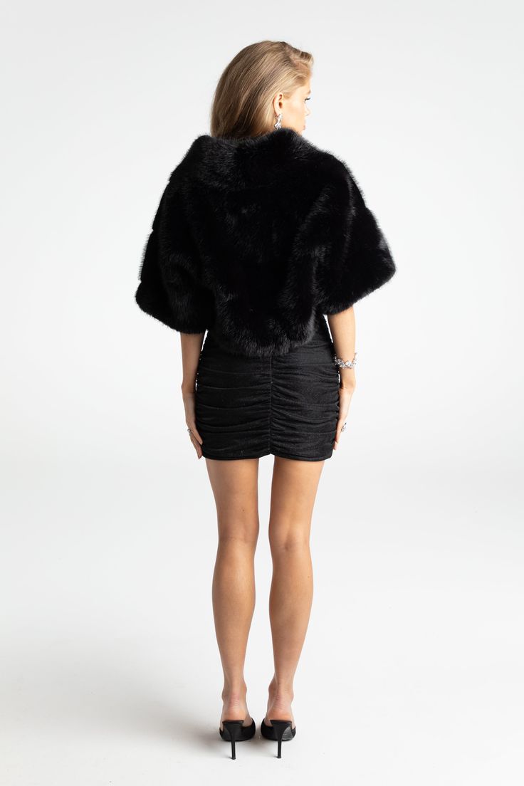 Cropped fur coats are our muse this season. Made of high-quality, environementally-friendly fur fabric, this chic coat is a perfect addition to your wardrobe. Its cropped design adds playfulness while the plush material adds warmth. Faux eco-friendly fur Cropped design Buckle included Dry clean only Luxury Faux Fur Outerwear For Evening, Chic Evening Fur Coat With Faux Fur Trim, Evening Faux Fur Coat For Fall, Fall Evening Faux Fur Coat, Faux Fur Coat For Night Out, Chic Black Fur Coat With Feather Trim, Black Fur Coat With Faux Fur Trim For Party, Luxury Black Fur Coat With Feather Trim, Chic Black Fur Coat With Faux Fur Trim