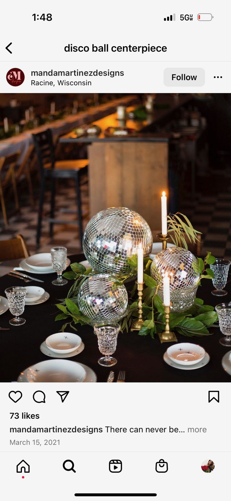 the table is set with silver dishes and candles