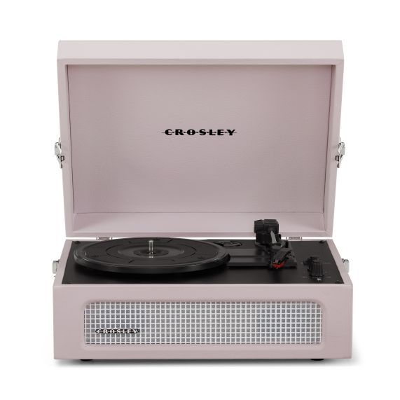 the crosley portable record player is shown in its pink case with black vinyl