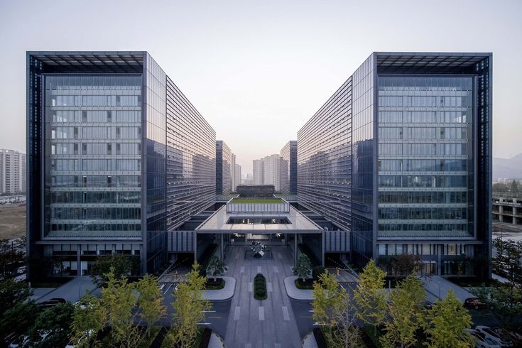 an aerial view of two office buildings in the city