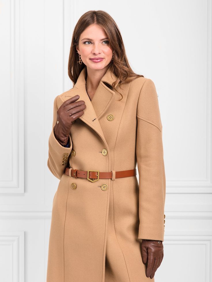 Meet your new formalwear favourite. This effortlessly elegant fitted Italian wool coat fits the bill perfectly. Complete with a waist-defining leather belt for a flattering finishing touch, the Victoria is fit for a garden party at Buckingham palace or even the Royal Enclosure at Ascot. Style with your smartest dresses and heels, or go short skirt and Amiras for Ladies’ Day. Italian wool: nothing but the best Antique brass buttons: premium hardware on the front and sleeves Back top chevron panel and chevron panel details on sleeves: a nod to our iconic chevron Leather belt with branded buckle: cinch in your waist with our unmistakable chevron buckle Fully lined with piping at fabric: incredible quality, inside and out Princess seams: flattering tailoring provides definition Centreback vent Ascot Style, Camel Wool Coat, Gold Shield, Fairfax And Favor, Coat Fits, Laptop Travel Bag, Wool Gloves, Brass Buttons, Deck Shoes