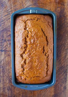 a loaf of banana bread in a blue pan