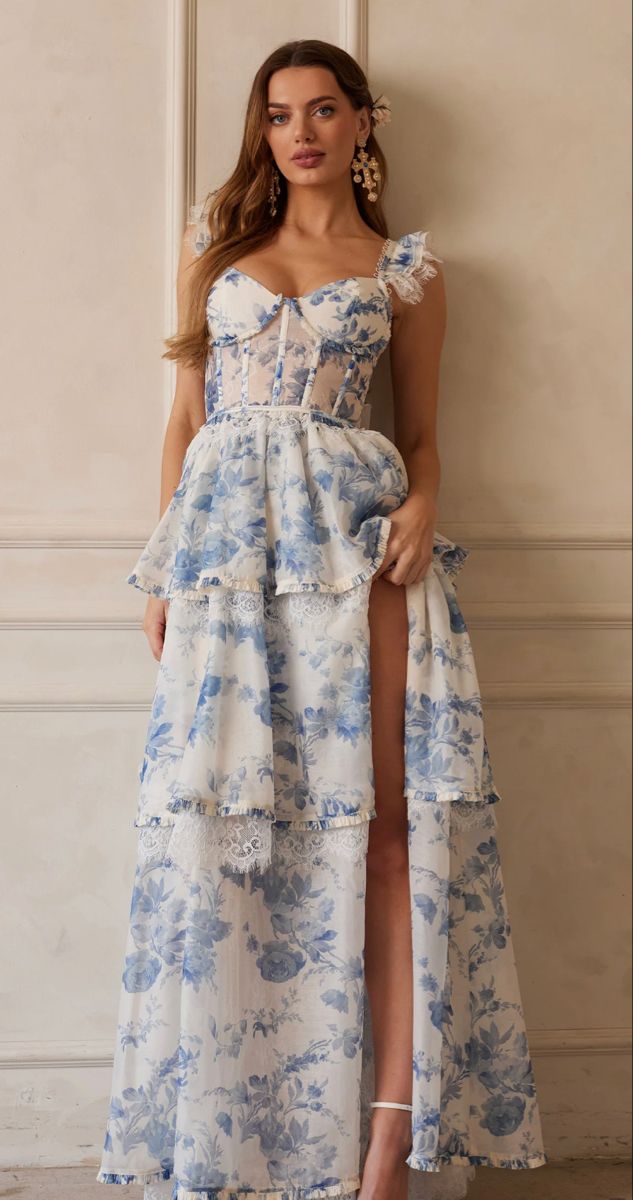 gorgeous blue and white floral formal dress White Dress With Floral Print, White Prom Dress With Blue Flowers, Blue And White Long Dress, Formal Floral Dress Long, Blue And White Flower Dress, Sleeveless Tulle Corset Dress With Ruffles, Wedding Corset Dress With Ruffles And Spaghetti Straps, Blue And White Formal Dress, Blue Ruffled Corset Dress For Wedding