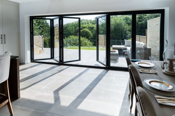 a dining room with sliding glass doors leading outside