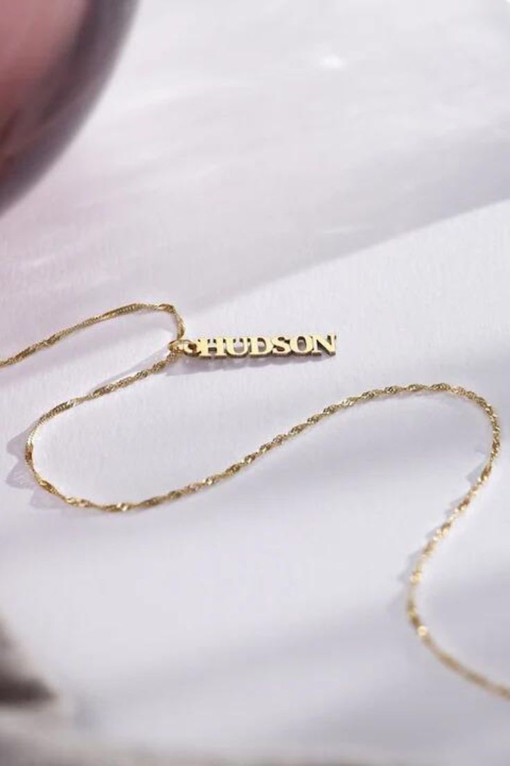 Make a statement with our Vertical Name Necklace, tailored to showcase your unique identity. Perfect for adding a touch of personal charm to any look. #NameNecklace #PersonalizedJewelry #SignatureStyle #thecustomgoodsco #customjewelry #jewelry #handmadejewelry #finejewelry Elegant Custom Name Jewelry For Anniversary Gift, Customized Nameplate Jewelry For Anniversary Gift, Custom Name Yellow Gold Jewelry For Anniversary, Custom Name 14k White Gold Jewelry, Silver 14k Gold Name Necklace For Anniversary, 14k Gold Nameplate Jewelry For Personalized Gift, Custom Name Jewelry For Valentine's Day, Custom Name Jewelry For Valentine's Day Personalized Gift, Customized Nameplate Jewelry For Valentine's Day