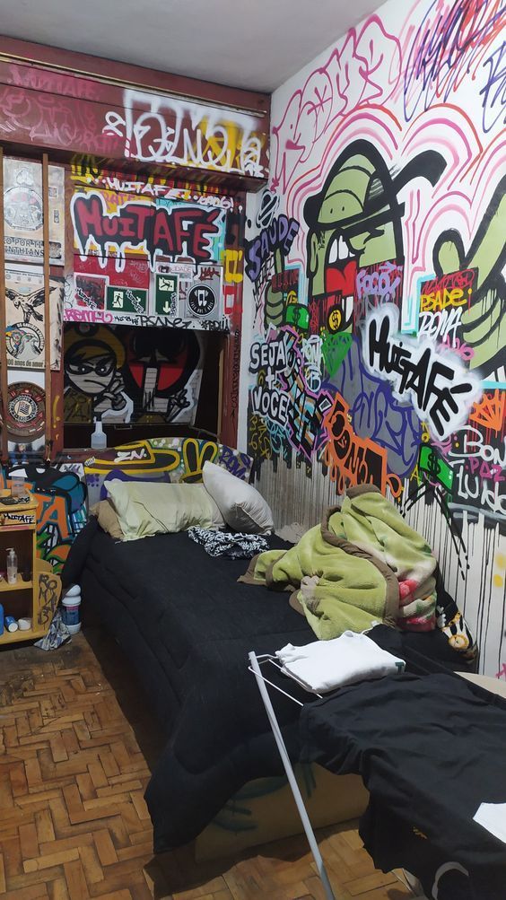 a bedroom with graffiti all over the walls