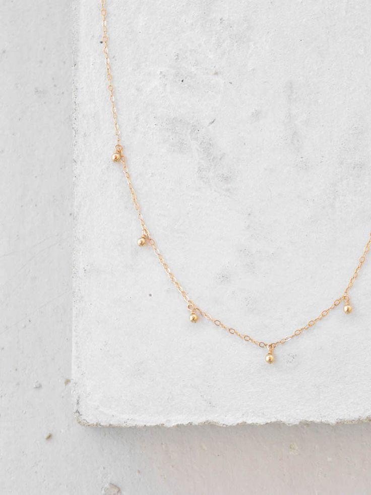 bohemian dangle necklace the faint hearted jewelry Gold Teardrop Beaded Necklaces With Dangling Beads, Gold Teardrop Beaded Necklace With Dangling Beads, Gold Minimalist Jewelry With Dangling Beads, Minimalist Gold Jewelry With Dangling Beads, Dainty Gold Necklaces With Dangling Beads, Dainty Gold Necklace With Dangling Beads, Everyday Delicate Chain Drop Necklace, 14k Gold Filled Dangle Jewelry With Tiny Beads, 14k Gold-filled Dangle Jewelry With Tiny Beads