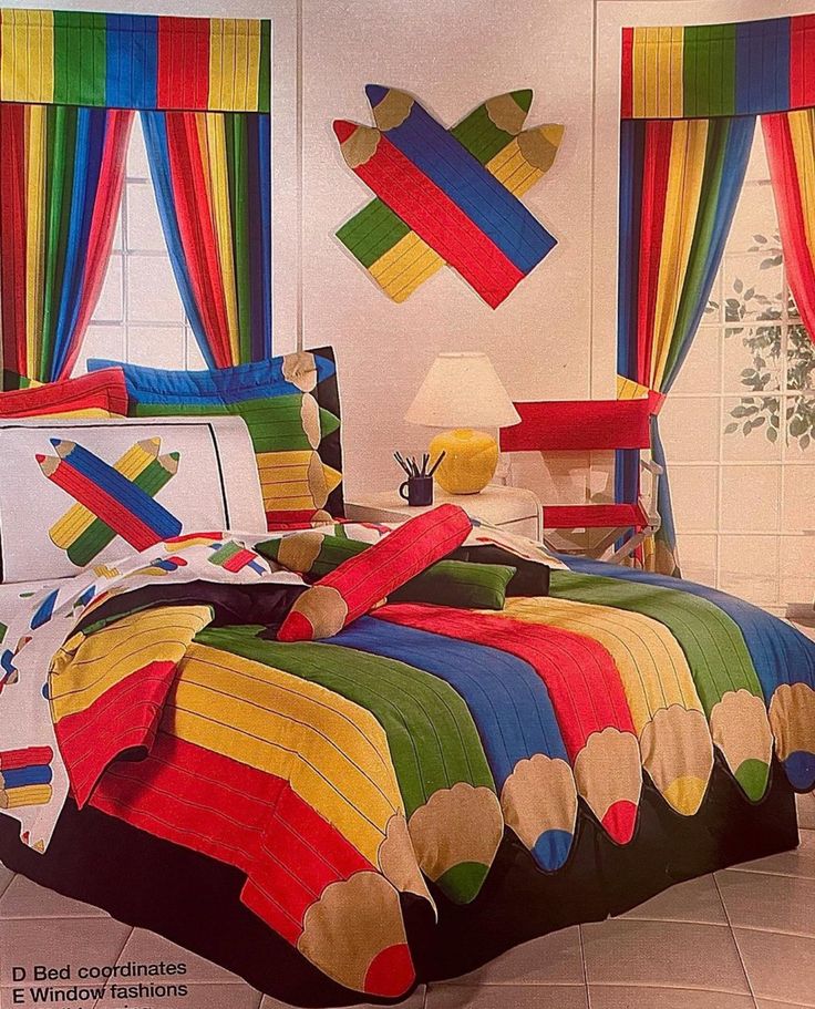 a bed room with a neatly made bed covered in colorful sheets and pillows on top of it