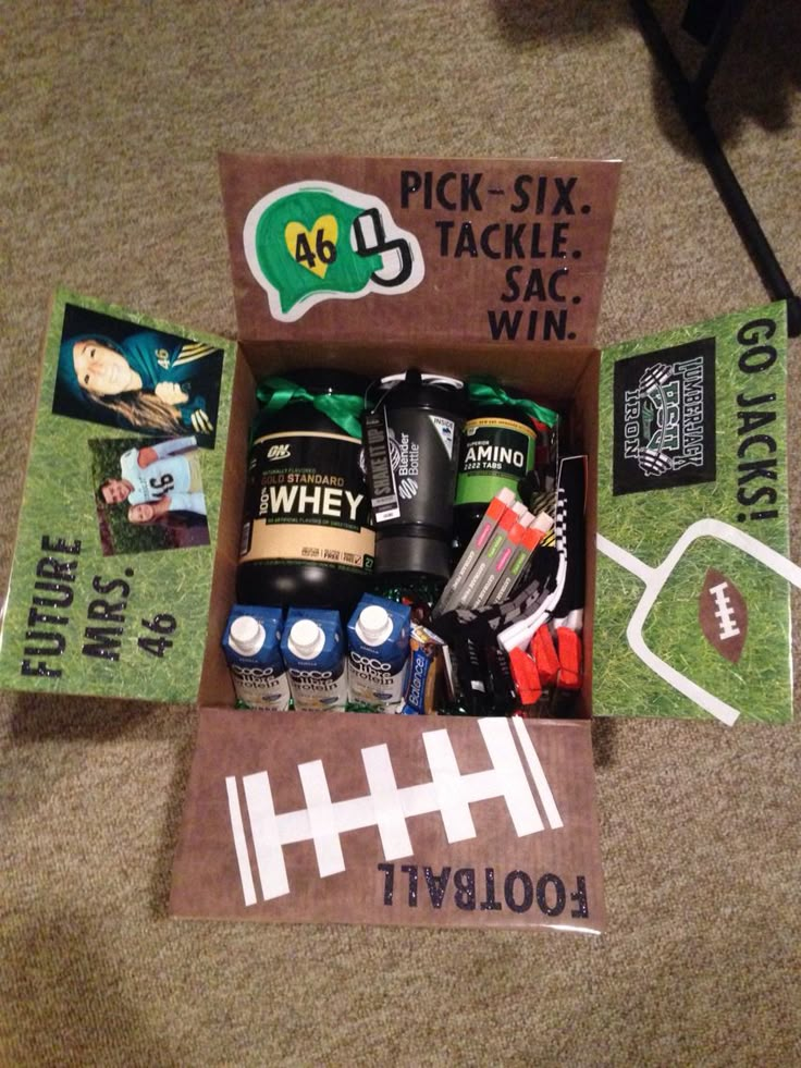 an open box with sports items inside on the floor