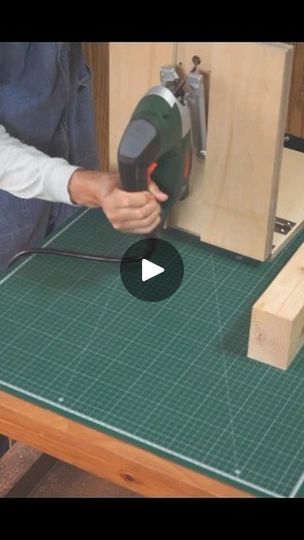 a person using a power tool to cut wood