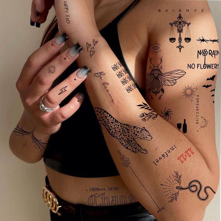 a woman with many tattoos on her arm